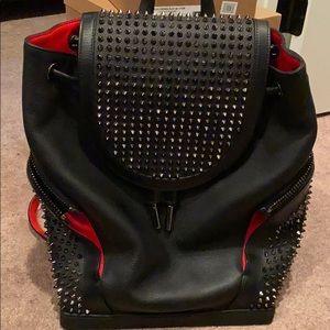 red bottom bookbag